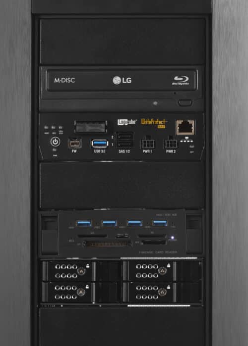 A black desktop computer with two hard drives and a monitor.