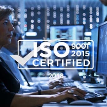 A woman from an IT services company is working on a computer with the word ISO certified showcasing her expertise.