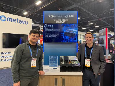 Two men stand at a tech booth featuring an "AUSA Global Force" display titled "3U Liquid-Cooled SSD Server," highlighting product details and a server model on the counter.