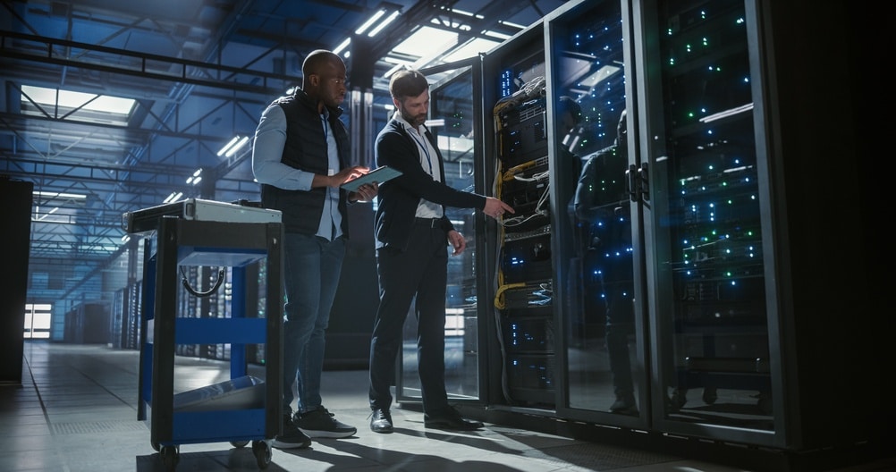 Two IT specialist working on a secure Data Center facility. Ace Computers Data Center Rack Capabilities.