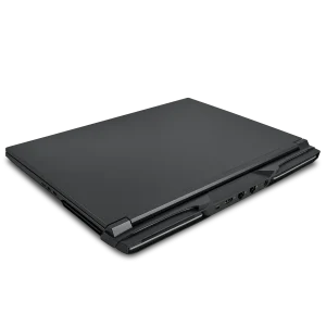 Closed black Raptor 5090 performance laptop viewed from the rear left angle, showing multiple ports and an angular, modern design.