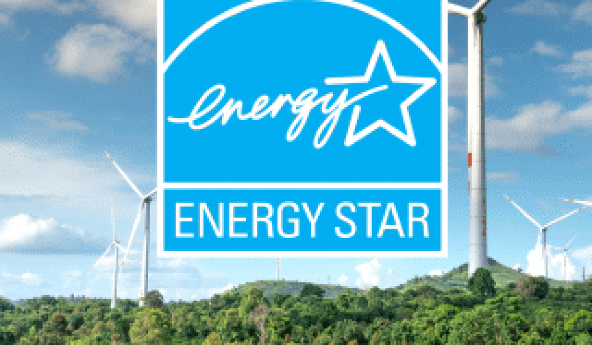 ENERGY STAR logo overlaid on a landscape with wind turbines and green vegetation under a partly cloudy sky, highlighting the benefits of ENERGY STAR Certified renewable energy solutions.