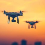 Close up photo of two Professional Remote Control Air Drones with action cameras flying in dramatic sunset sky. Modern technologies. Travel, hobby, inspiration. Pastel orange toning. Kiev, Ukraine SSUCv3H4sIAAAAAAAEAH1TuW7jMBDtF8g/GKxtrCjqcFJuv106IwVFTmTClCjwcGwE/velzozsbDq+NweH7w0/n35tNqTiTgnysvnsUcRK6+C85V6ZNtLJduJBKm+s4rone+42RIjz3AcHDrWgKbPvEbO5lmveXDEheOu8EafuaLyJAboEjDbBVuayyrYwZN9xccQzNNyewOOIhM445YfWbhWIJY3zqgHMguswfI9VWnFMderi14RpZY4Jdwzeg30Y8qwkmEpHdhgEqSa4hzrKudJttuIw4s0cmCTrX0n+cHGqrQmtdL9f4eJD1IZsUZ4L1V0emaO37Q+NX0Ec26h+ff2u3V/lBGjNWzABNRwPb4vPNbTi+vWilZ4H1JUmBaNLm7flwrVHuGI11ApQVnzX6WFBVvez7KtmPNyQOxY08HGnD2NLcvqIBjeDW1PSYC7CPEhlkJtnI7i+972zSqi2RmXGH8EiLOLvMw0iWuOHSaZXExlXp4eU0ZJmZVEkWZHlZZozMv/IuHBK4lnHT3pUMWSRPyR02nAJ8j+W0Twtk4SydD9ptCx8qBoVV/7nwrSg7FFc1RcR9pw/V4nId7Sskl1WZnS3T6p0V0jYl6zkRcLTaNHtH+EUJm2lBAAA