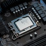 Close-up of an Intel CPU installed on a motherboard, showcasing the intricate surrounding components and circuitry, ideal for a Custom PC Builder.