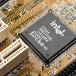 Close-up view of an Intel PCIset chip on a computer motherboard with visible circuits and connectors, showcasing the integration of HPC technology.