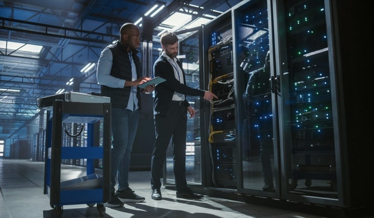 Two IT specialist working on a secure Data Center facility. Ace Computers Data Center Rack Capabilities.